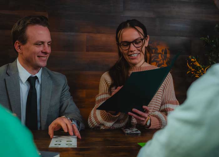 woman and a man looking at documents